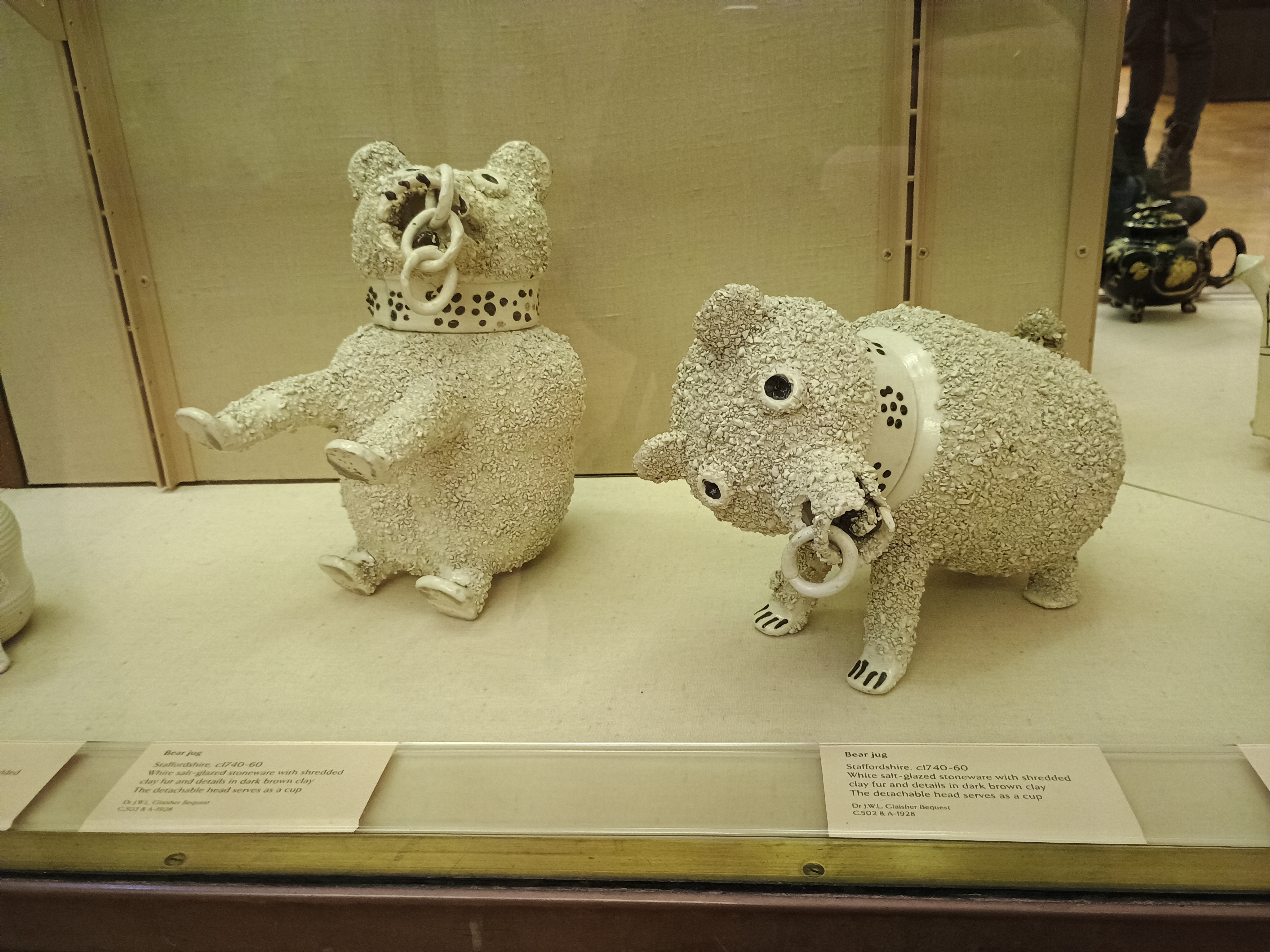 Two Staffordshire bear jugs 