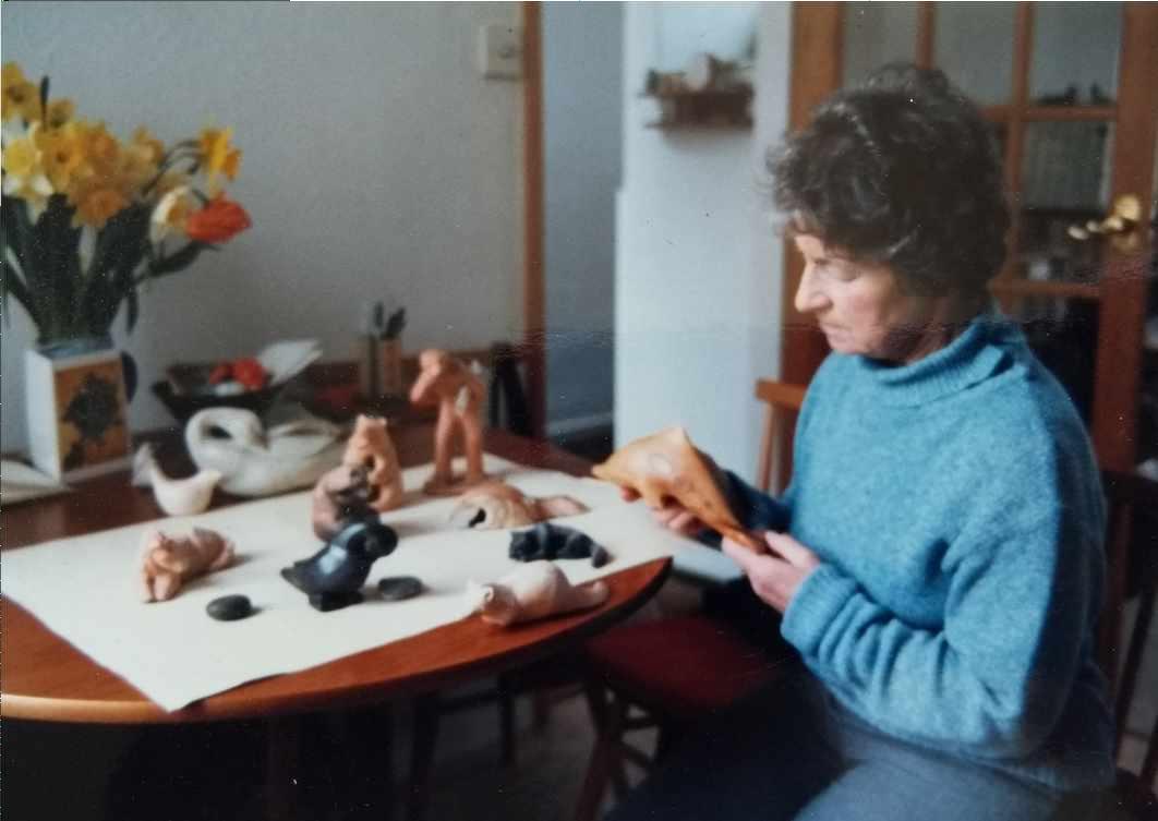 Ulla Frisch with some of her pottery creatures
